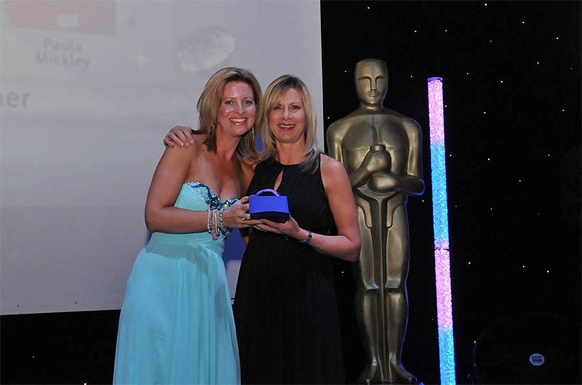 Lynne Heard receiving an award